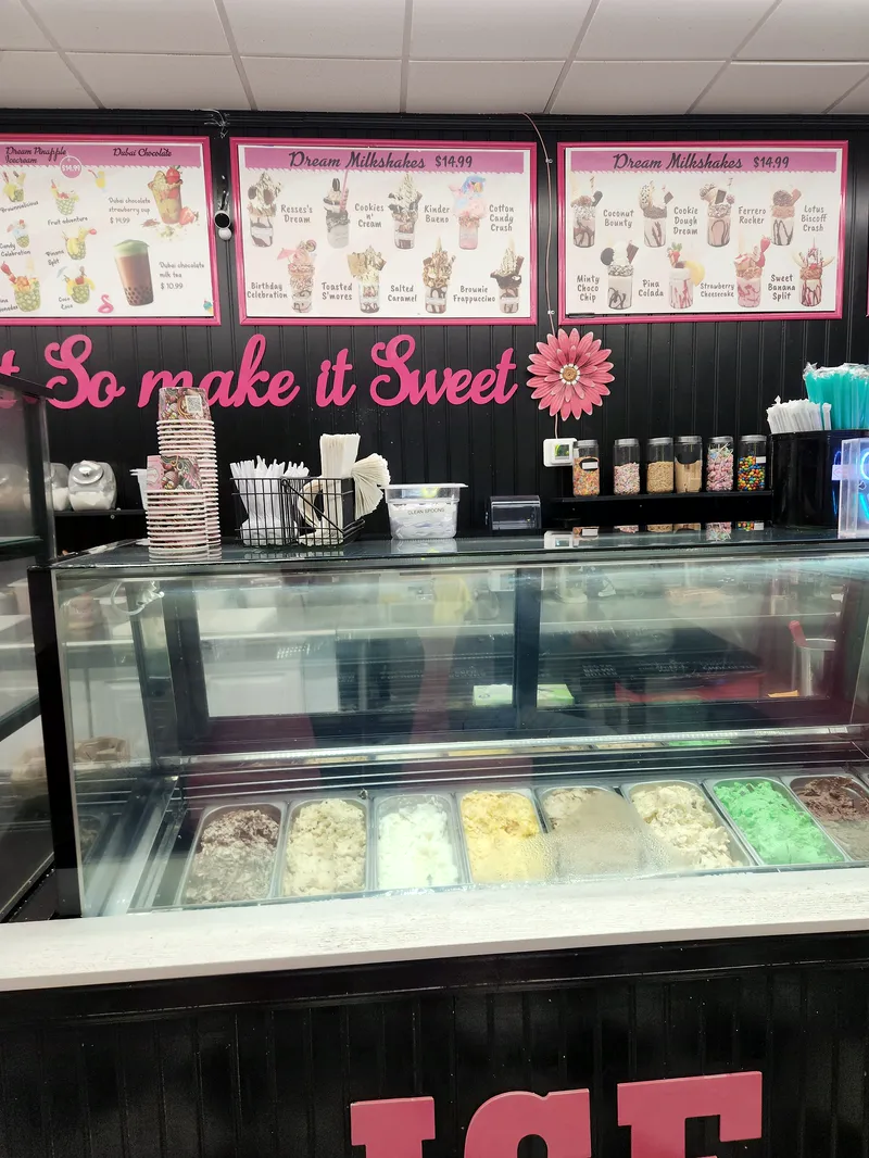Their ice cream case under the pink wall letters So make it Sweet